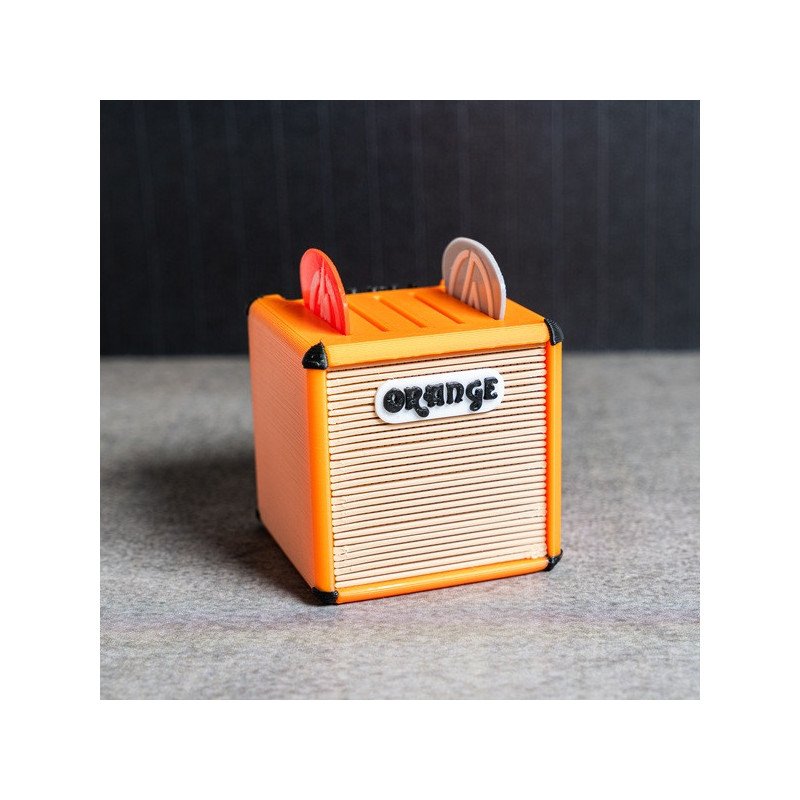 Portapúas con diseño de amplificador Orange en color naranja con detalles en negro, visto de frente Portapúas con diseño de amplificador Orange en color naranja con detalles en negro, visto de frente