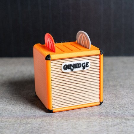 Portapúas con diseño de amplificador Orange en color naranja con detalles en negro, visto de frente